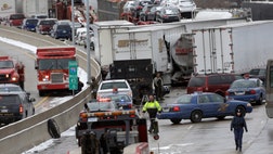  Blinding snow squalls, high winds and a slick highway led to a mile-long series of crashes in Detroit that left at least three people dead, including two children, and  more injured.